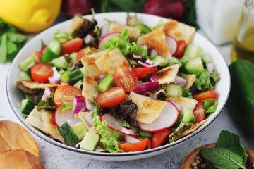 A bowl with Fattoush - Traditional Levantine salad