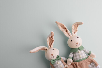 Family of Easter rabbits on pastel background. Top view