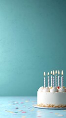 Birthday cake with lit candles and sprinkles