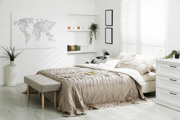 Comfortable bed with beautiful linens in bedroom