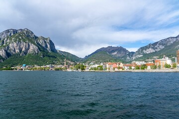Fototapeta premium Scenic view of Lecco city with mountains and lake.