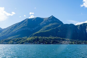 Lake Como with mountains and clear sky.