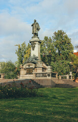 statue in the park of warsaw city hall