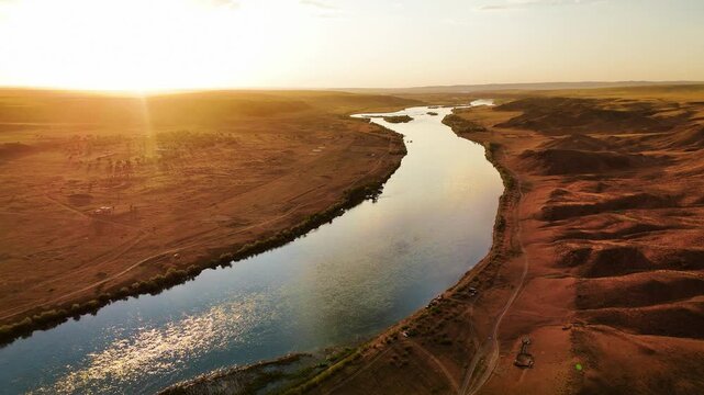 Drone shot of river Ili and spring steppe in Kazakhstan