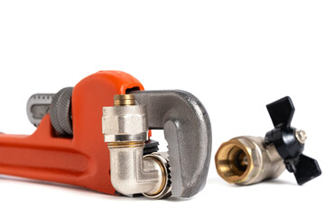 Plumbing pipe and adjustable wrench isolated on white background.