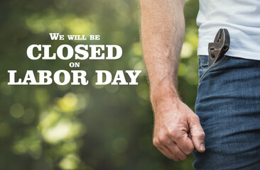 Signboard with the inscription We will be closed on Labor Day. Congratulations for family, loved...