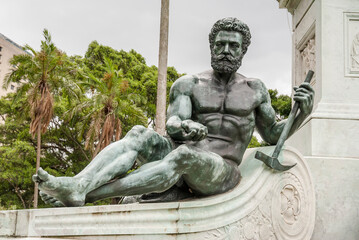 Decorative fountain bronze sculpture of Cyclops in Sydney, Australia on an overcast day with palm trees in the background_20101217_05041.
