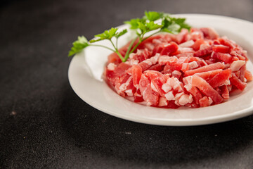 Bacon cubes smoked chopped meat small pieces fresh delicious gourmet food background on table rustic food top view copy space