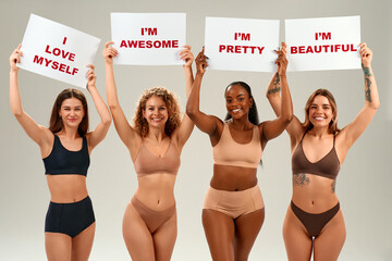Diverse women holding self-love signs promoting body positivity and confidence