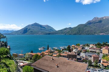 Fototapeta premium Lake Como scenic view with mountains and town.