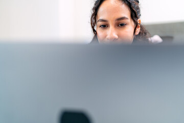 Digital nomad working remotely from airbnb apartment using laptop