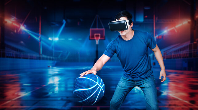 Basketball player bouncing basketball hologram at futuristic sport arena. Energetic athlete or sport person practicing basketball skill by using augmented reality technology. Innovation. Ingenuity.