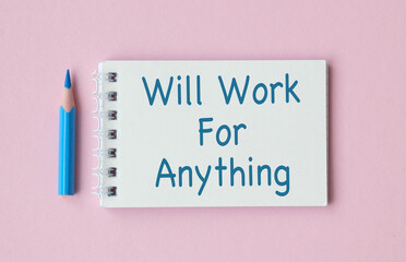A pencil is on top of a spiral bound notebook that says Will Work For Anything