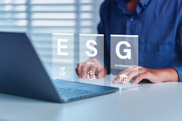 ESG icon of saving clean energy environment social governance concept, Man hand tying laptop to analyze on screen in business investment strategy, green eco friendly, environment, go green, CO2, ESG