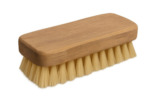 Natural-bristled wooden cleaning brush resting on transparent surface, ready for home cleaning tasks