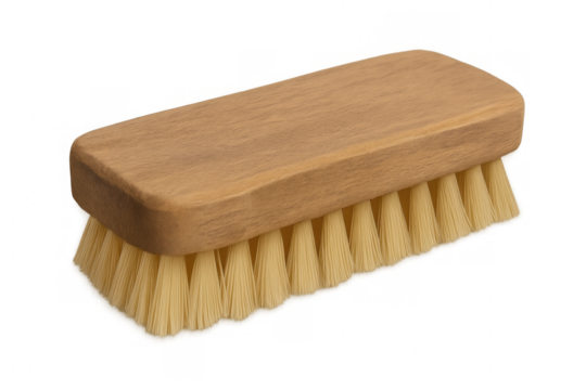 Natural-bristled wooden cleaning brush resting on transparent surface, ready for home cleaning tasks