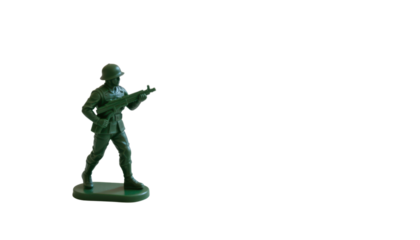 the image features a small, molded figure of a combatant. the figure is made of green plastic and is depicted in a posed stance, holding a gun