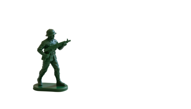 the image features a small, molded figure of a combatant. the figure is made of green plastic and is depicted in a posed stance, holding a gun