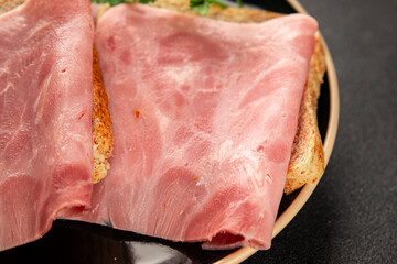 Ham slices meat spam pork fresh delicious gourmet food background on the table rustic food top view...
