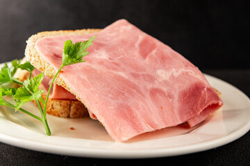Ham slices meat spam pork fresh delicious gourmet food background on the table rustic food top view...