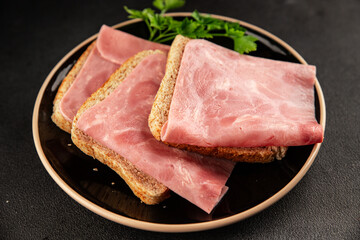 Ham slices meat spam pork fresh delicious gourmet food background on the table rustic food top view copy space