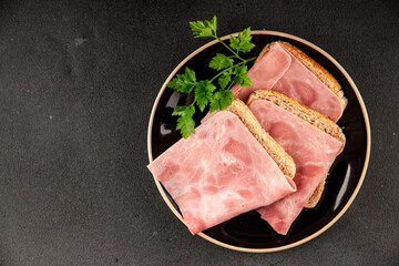 Ham slices meat spam pork fresh delicious gourmet food background on the table rustic food top view...