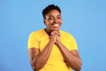 Please Concept. Overweight African American Lady With Clasped Hands Begging Making Pleading Gesture...