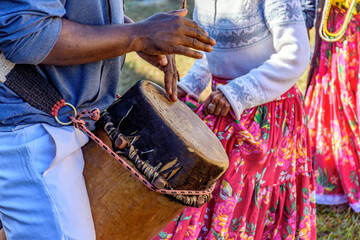 Rustic atabaque of African origin played in a presentation of Brazilian popular culture