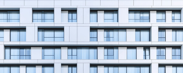 Modern building facade with large windows and clean lines in an urban setting. Contemporary architecture and geometric design