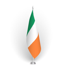 Obraz premium Ireland flag - 3D standard conference flag hanging on ground flagpole. Usable for summit, indoor meeting, board room, government office, press room or reception. Vector flag with shading