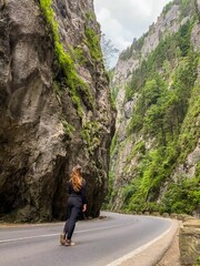 Woman standing between mountains, Romania