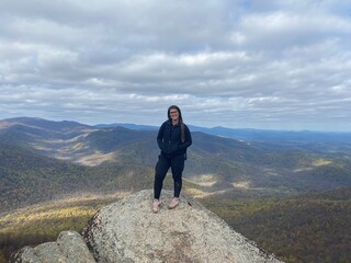 Woman posing on top of rock in the mountains, Shenandoah National Park