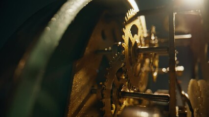 Inner cogs working inside traditional time device closeup. Metal wheels rotating