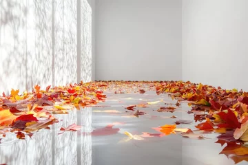 Fototapete Autumn leaves fill a bright, minimalist room, reflecting light off a glossy floor and creating an artistic scene. © Harsha