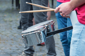 Street orchestra playing snare drums