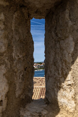 KRK, Croatia, May 28, 2025 - Frankopan Castle in Krk, ruins of the tower, courtyard with a square...