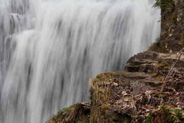 Cascade of Wadsworth Falls beyond a rock ledge, in Connecticut.