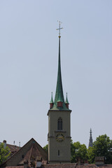 Tall church spire against a clear sky, showcasing classic architecture and a serene, timeless presence. Elegant and historically rich.