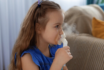 Caucasian young girl using nebulizer for respiratory treatment at home. Respiratory Therapy