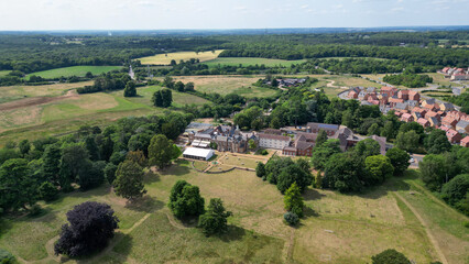 Aerial view of park and woodland showing fields, housing estates and nature