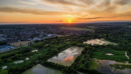 Aerial view of Hoddesdon, Hertfordshire showing river, sunset and housing estate