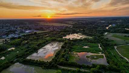 Aerial view of Hoddesdon, Hertfordshire showing river, sunset and housing estate