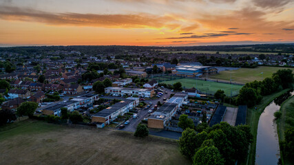 Aerial view of Hoddesdon, Hertfordshire showing river, sunset and housing estate