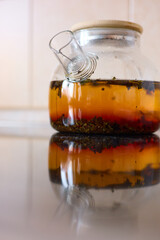 tea is brewed in a glass teapot, evaporation drops on the walls of the teapot