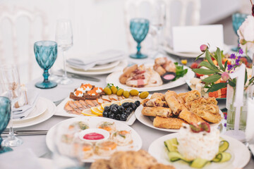 Delightful array of gourmet cuisine displayed elegantly at a festive banquet table during a warm afternoon gathering