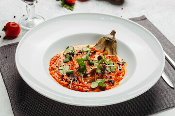 Georgian cuisine dish in a restaurant on a light background