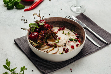 Georgian cuisine dish in a restaurant on a light background
