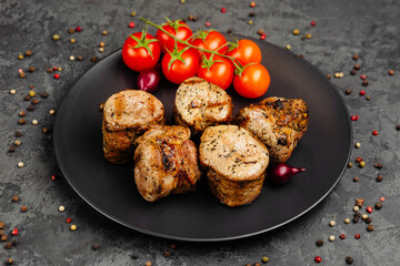 juicy golden grilled barbecue meat with spices on dark background