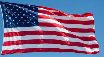 Fototapeta premium Vibrant American flag proudly waving against a clear blue sky, symbolizing freedom, patriotism, and national pride. Perfect for Fourth of July, Memorial Day, election campaigns, or any US-themed