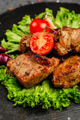 juicy golden grilled barbecue meat with spices on dark background